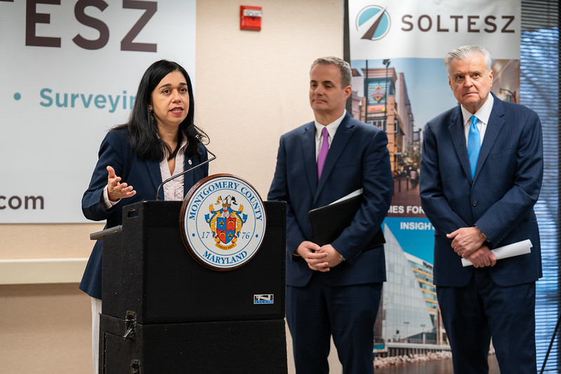 Council President Fani-González speaks at a podium at Soltesz in Rockville.